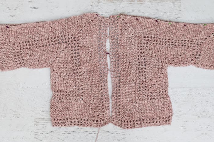 Tutorial describing how to make a crochet hexagon sweater including how to seam the hexagons together.