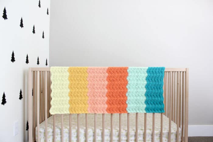 Gorgeous! Every new baby deserves a warm welcome into the world and this easy gender neutral crochet baby blanket pattern puts a modern twist on the traditional ripple. Made using Lion Brand's Baby Soft yarn. 